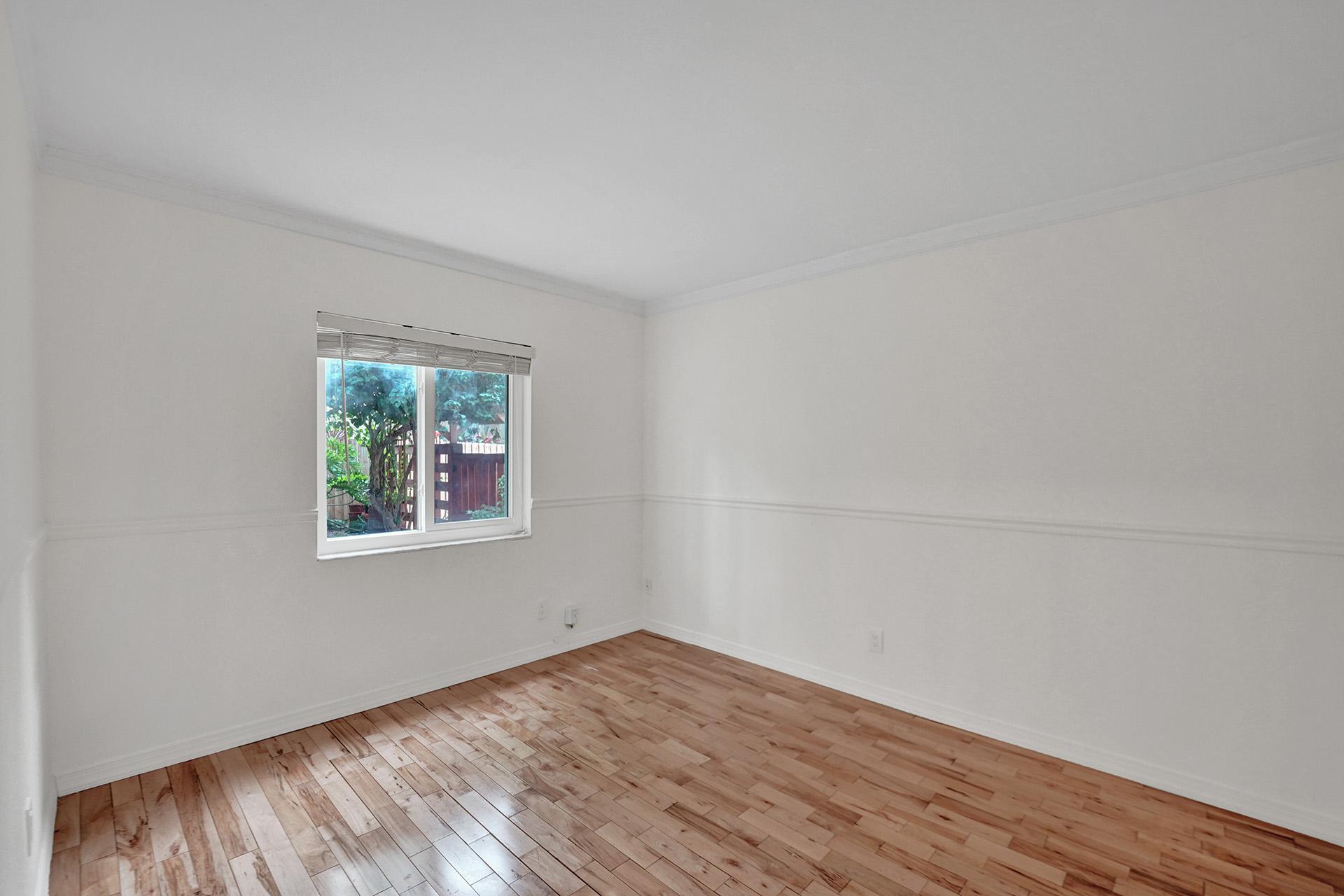 2941 Northwest 24th Way Boca Raton, FL 33431 - Photo 34 of 53 wooden floor in an empty room with a window