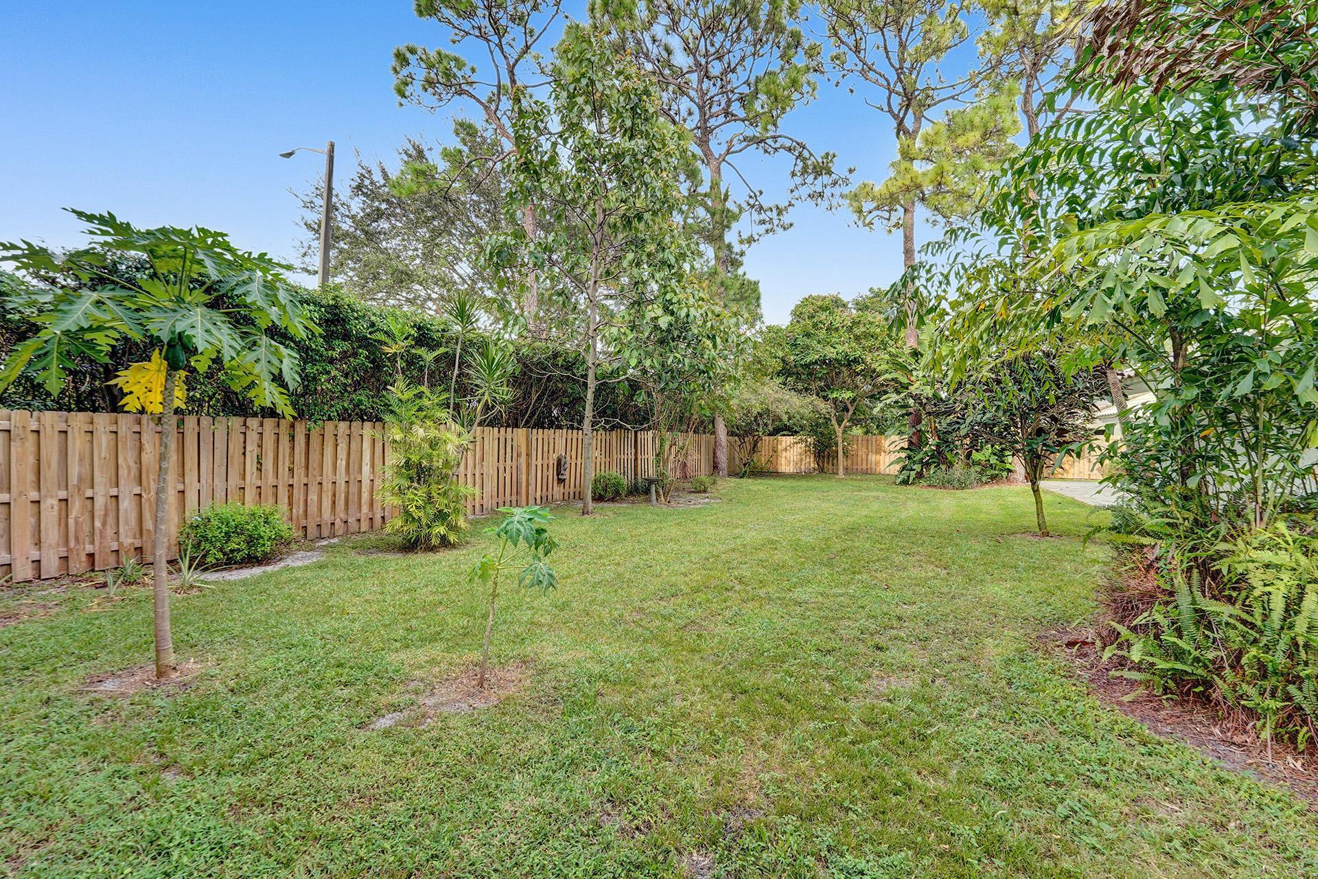 2941 Northwest 24th Way Boca Raton, FL 33431 - Photo 47 of 53 a green field with lots of trees in the background