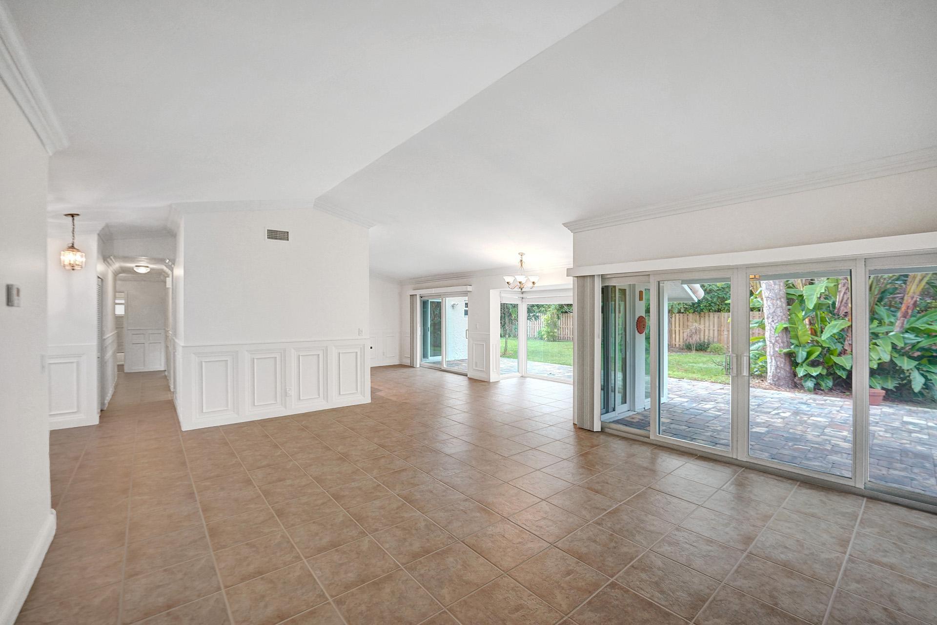 2941 Northwest 24th Way Boca Raton, FL 33431 - Photo 9 of 53 a view of an empty room with large windows