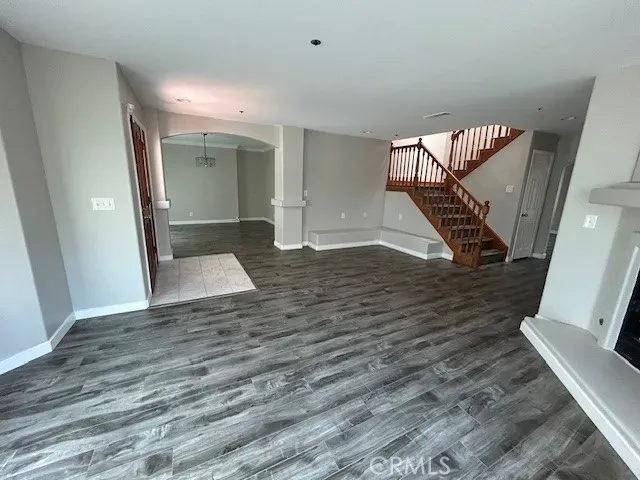 wooden floor in an empty room with a mirror
