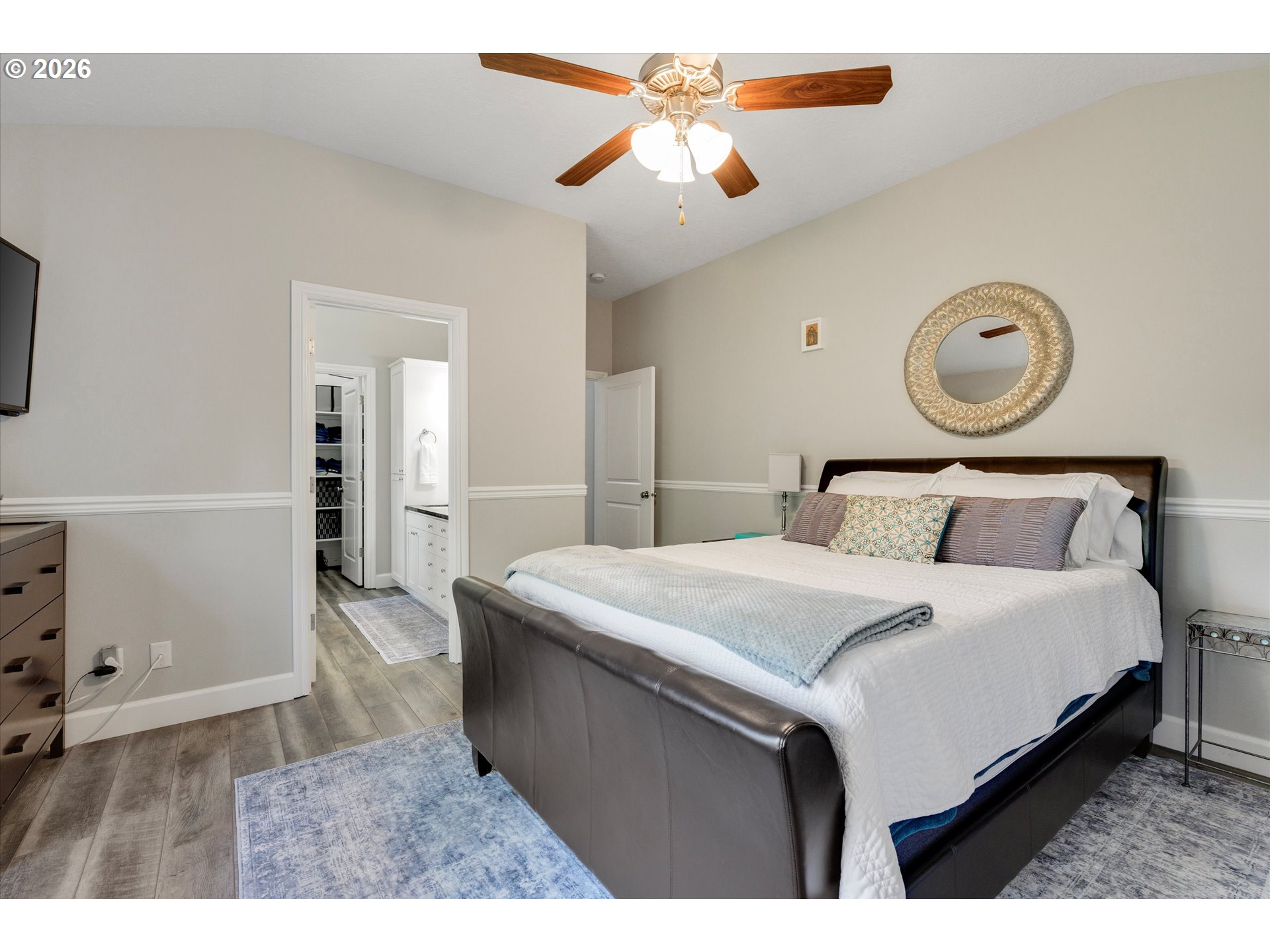 3769 10th Street Hubbard, OR 97032 - Photo 22 of 47 a bedroom with a bed and a chandelier