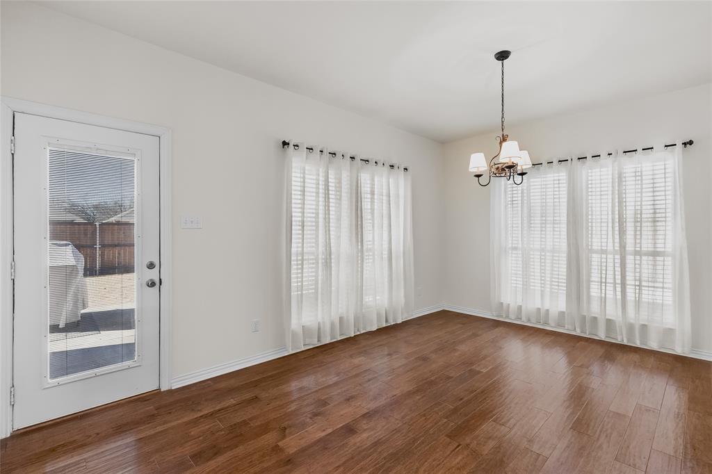 1308 Madeline Street Commerce, TX 75428 - Photo 19 of 37 a view of empty room with wooden floor and fan