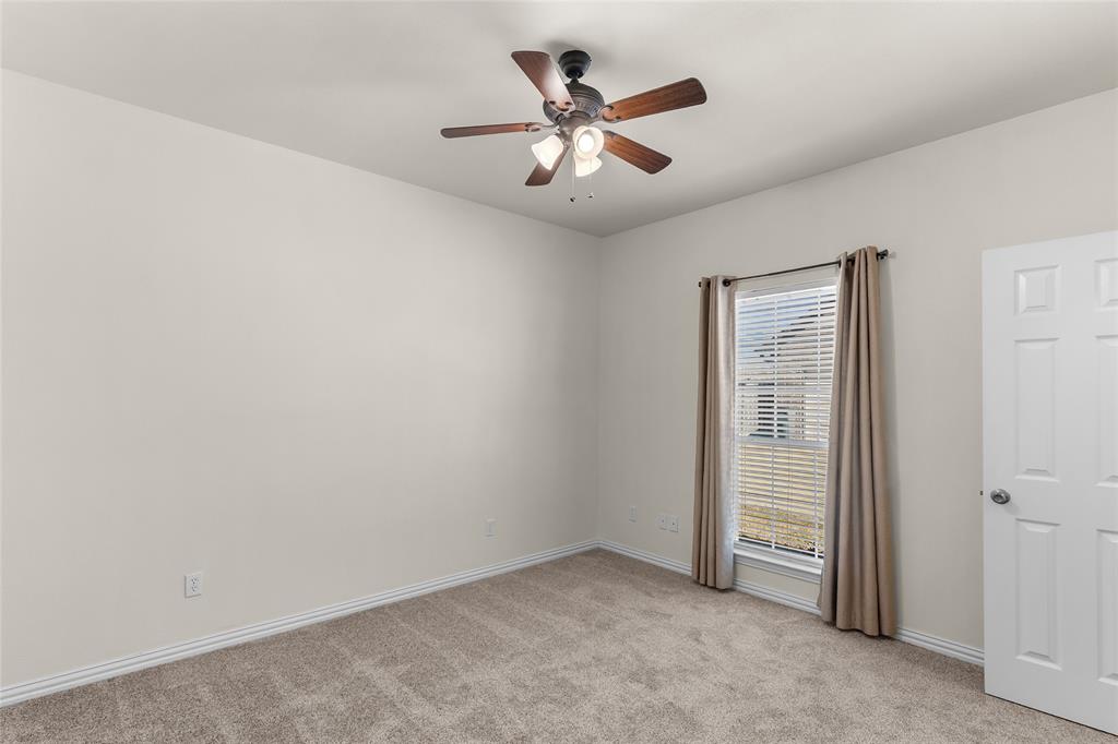 1308 Madeline Street Commerce, TX 75428 - Photo 29 of 37 an empty room with closet and fan