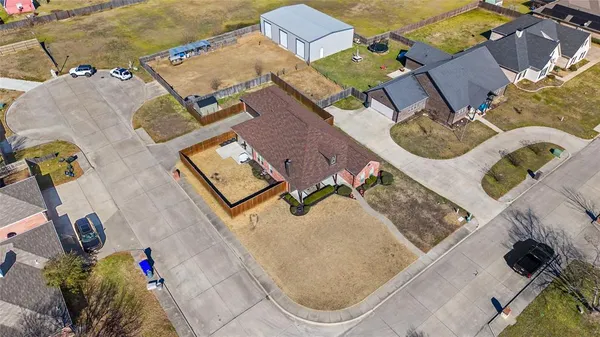 an aerial view of a house with swimming pool