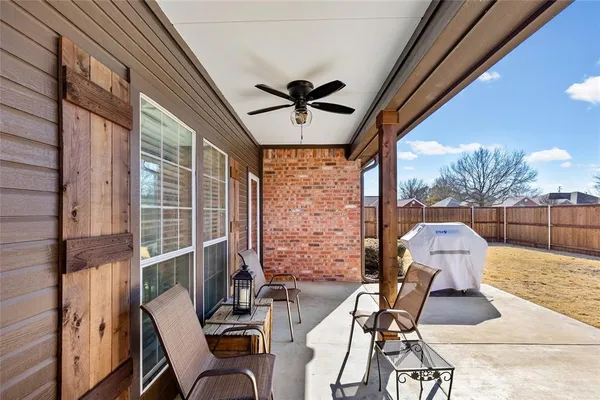 a view of balcony with chairs and wooden floor