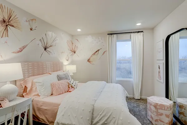 a bedroom with a bed and a table in it