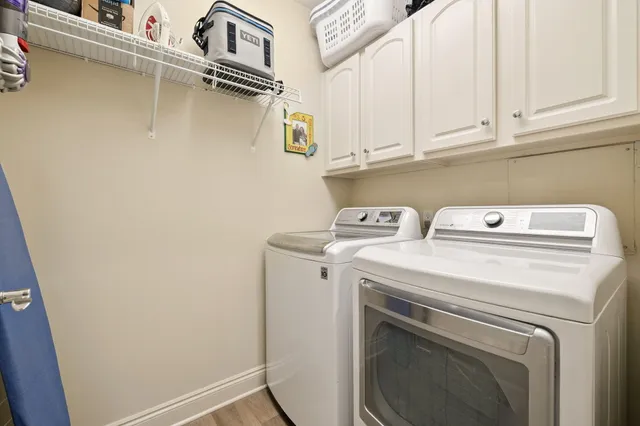 a utility room with dryer and washer