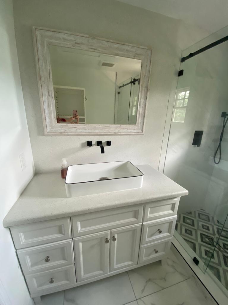 16355 Downers Drive East, Unit 2 Loxahatchee, FL 33470 - Photo 6 of 8 a bathroom with a sink and a mirror