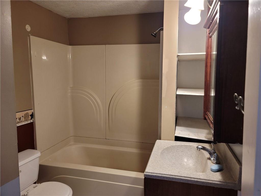 211 Summit Street Butler, PA 16001 - Photo 11 of 17 a bathroom with a sink and a mirror