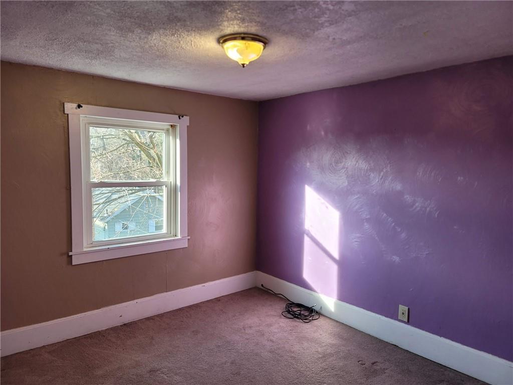 211 Summit Street Butler, PA 16001 - Photo 12 of 17 an empty room with windows and bed