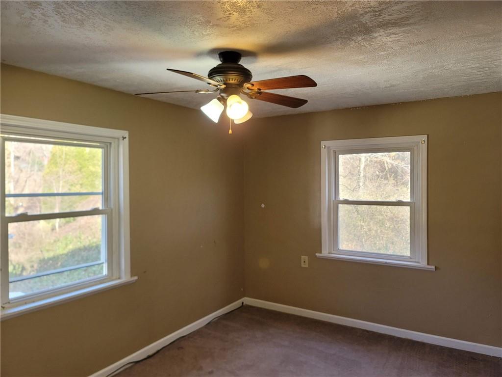 211 Summit Street Butler, PA 16001 - Photo 14 of 17 a view of an empty room with a window