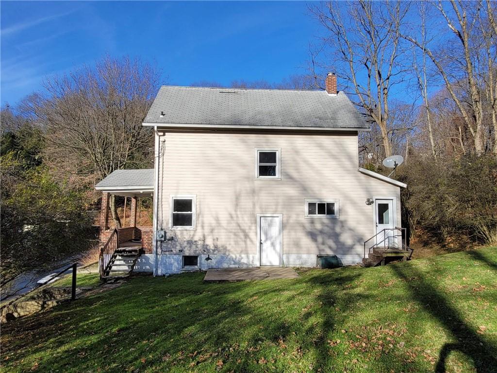 211 Summit Street Butler, PA 16001 - Photo 16 of 17 a view of house with backyard