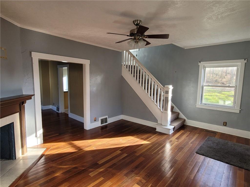 211 Summit Street Butler, PA 16001 - Photo 4 of 17 a view of an entryway with wooden floor and livingroom