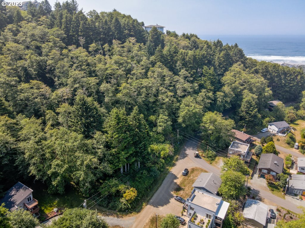 South 3rd Avenue Rockaway Beach, OR 97136 - Photo 5 of 7 an aerial view of a house with a yard