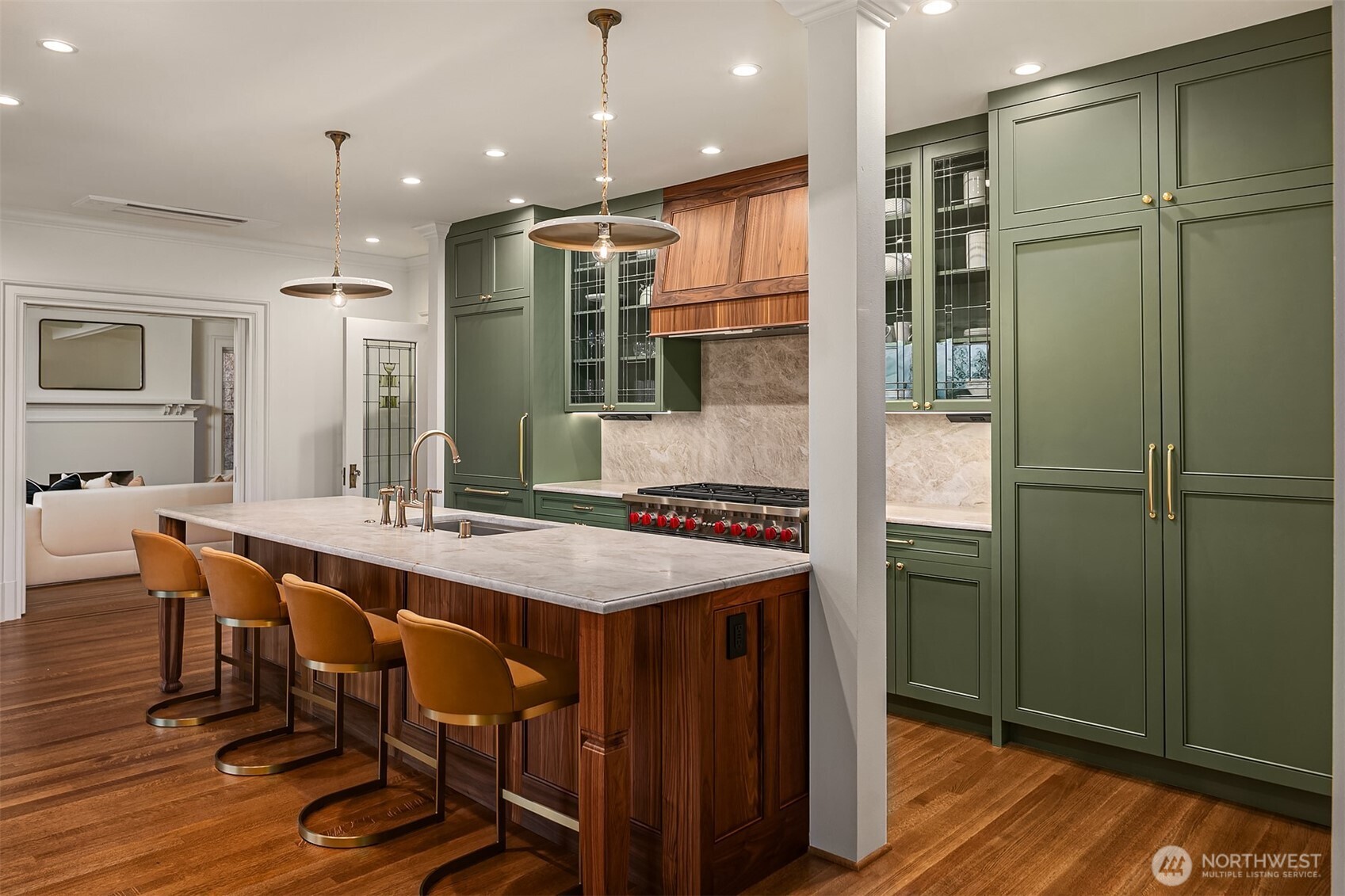 740 22nd Avenue East Seattle, WA 98112 - Photo 11 of 40 a dining hall with stainless steel appliances granite countertop a table chairs and a refrigerator