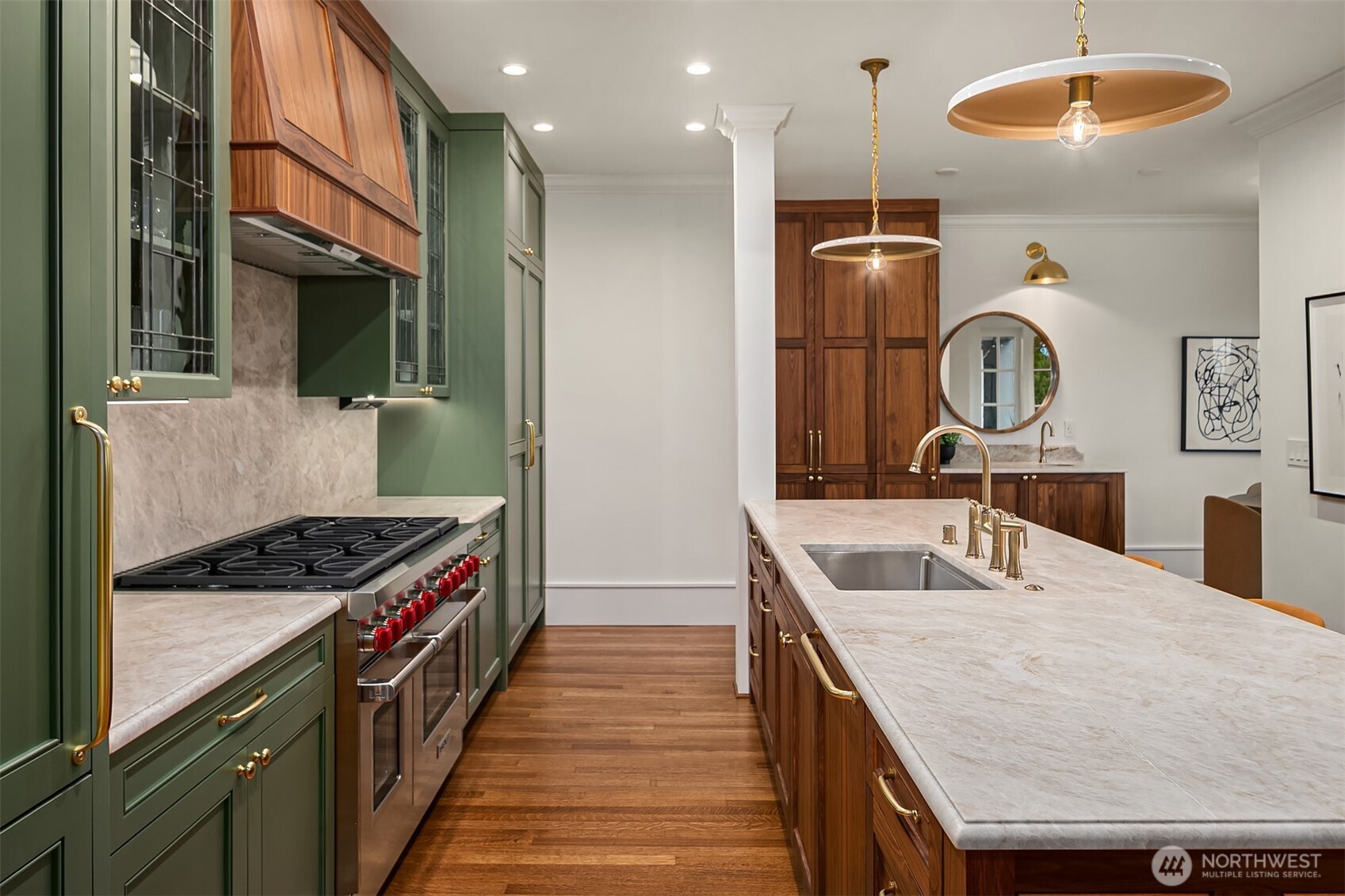 740 22nd Avenue East Seattle, WA 98112 - Photo 13 of 40 a kitchen with granite countertop a sink a stove and cabinets