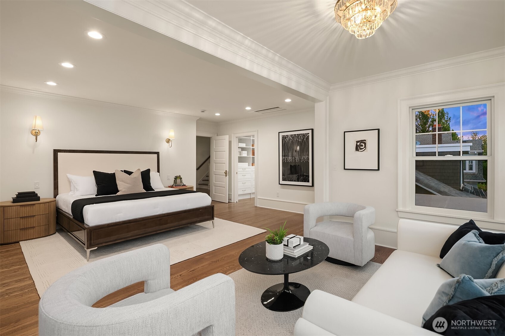 740 22nd Avenue East Seattle, WA 98112 - Photo 21 of 40 a bedroom with furniture and a chandelier