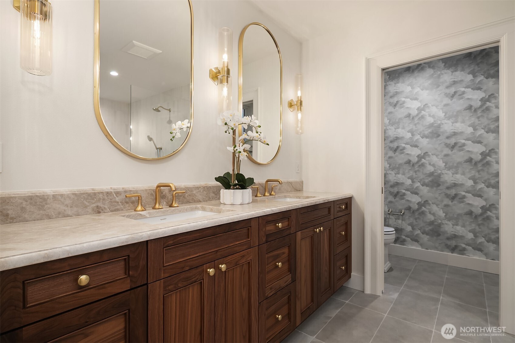 740 22nd Avenue East Seattle, WA 98112 - Photo 22 of 40 a bathroom with a double vanity sink and a mirror