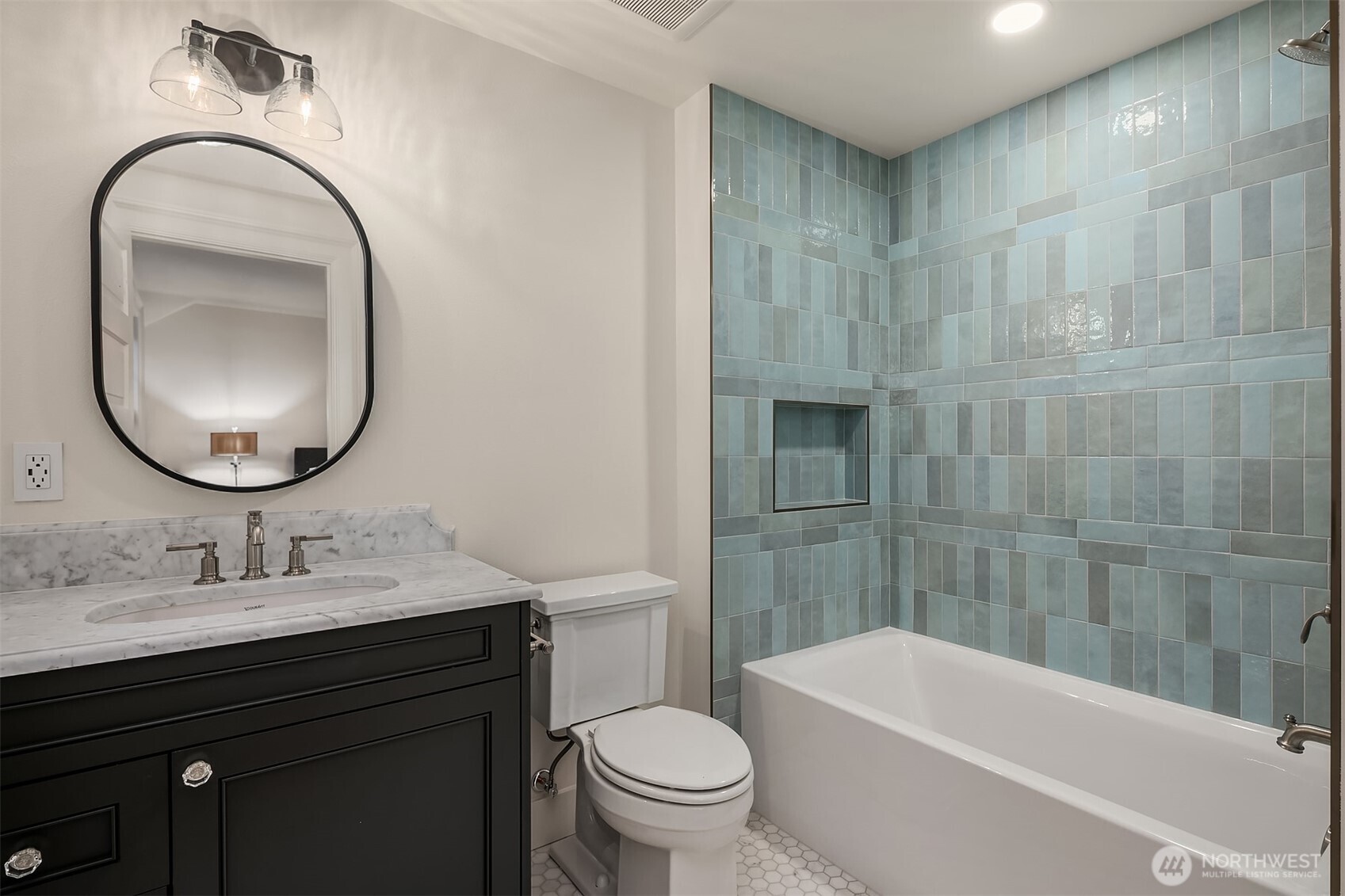 740 22nd Avenue East Seattle, WA 98112 - Photo 26 of 40 a bathroom with a sink a toilet and a mirror