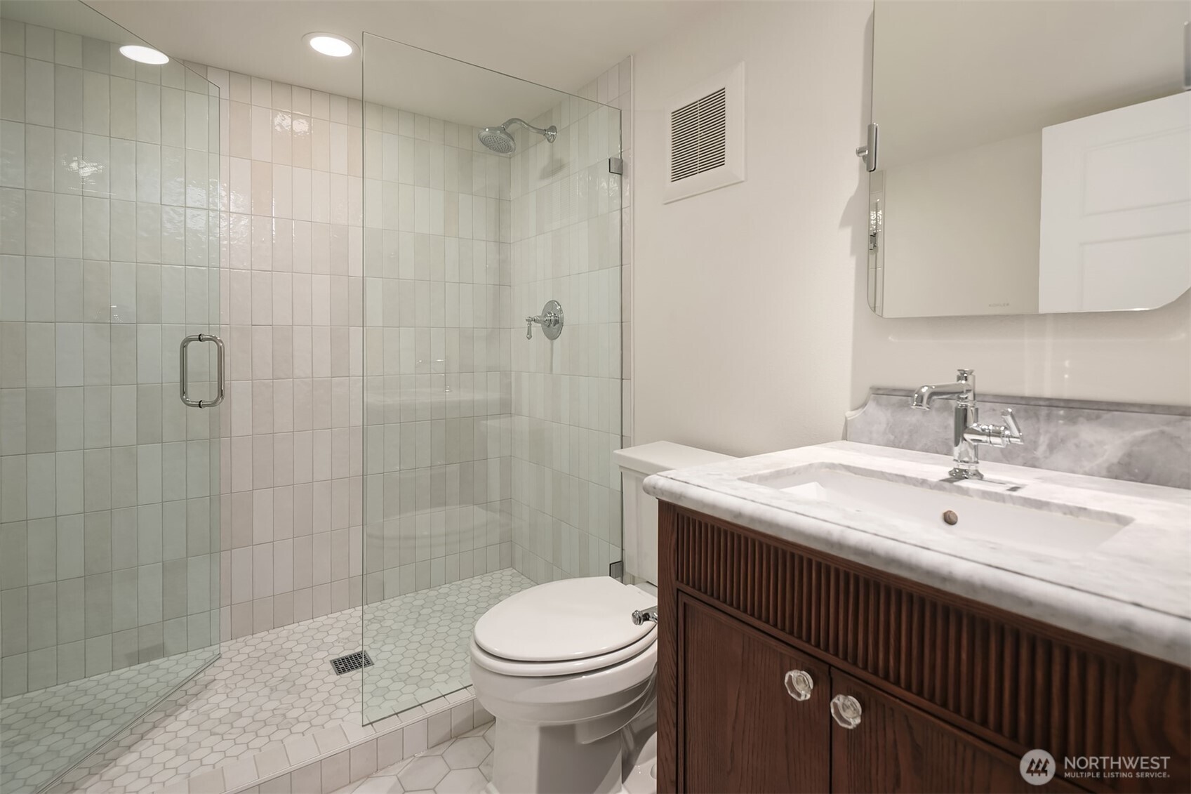 740 22nd Avenue East Seattle, WA 98112 - Photo 31 of 40 a bathroom with a sink a toilet and shower