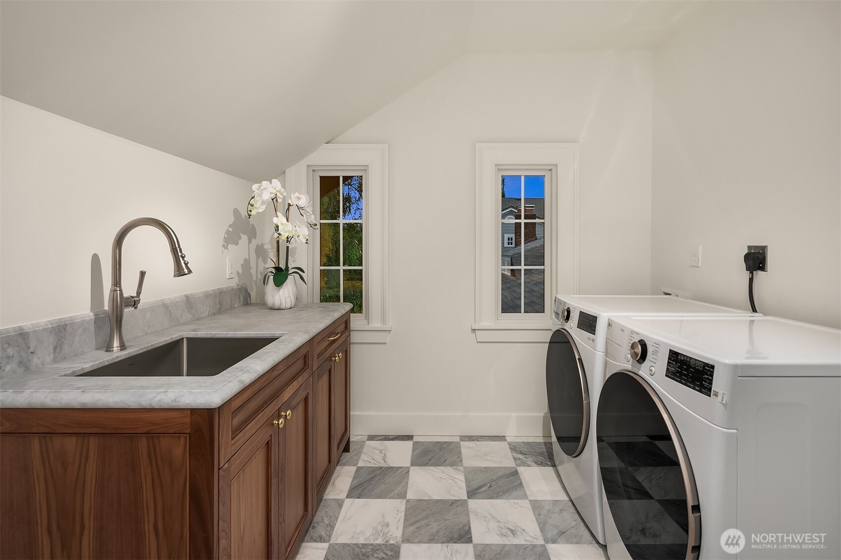 740 22nd Avenue East Seattle, WA 98112 - Photo 34 of 40 a utility room with sink dryer and washer