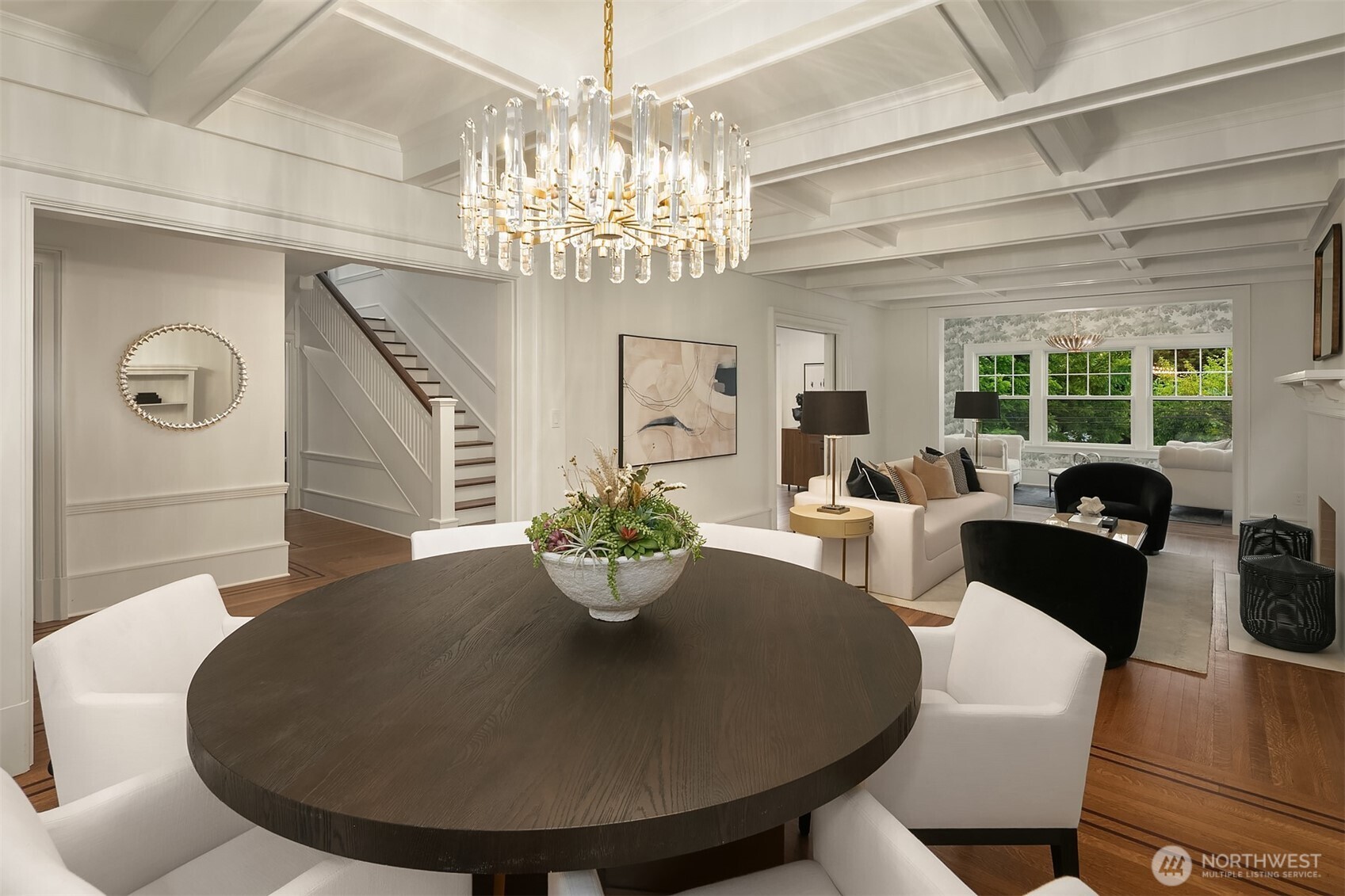 740 22nd Avenue East Seattle, WA 98112 - Photo 6 of 40 a living room with furniture a chandelier and a dining table