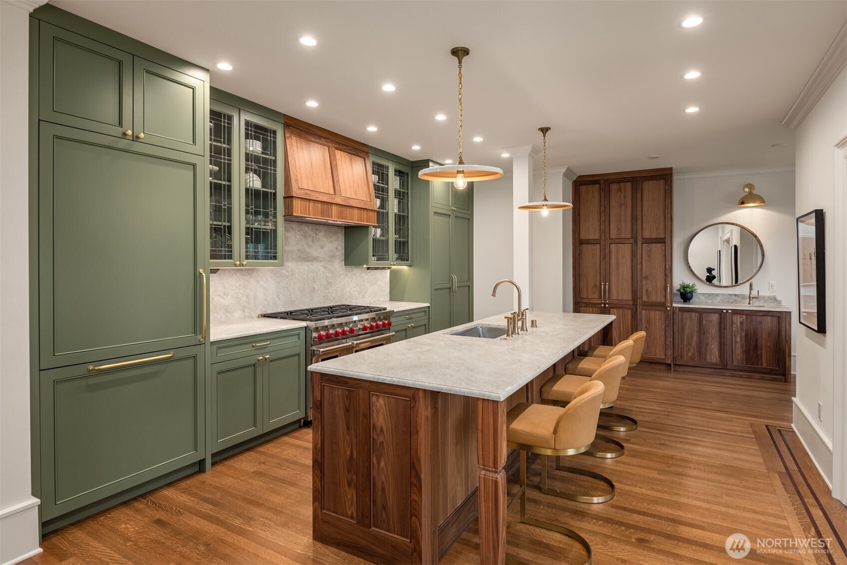 740 22nd Avenue East Seattle, WA 98112 - Photo 10 of 40 a kitchen with stainless steel appliances granite countertop a refrigerator a sink dishwasher a stove and a refrigerator with wooden floor
