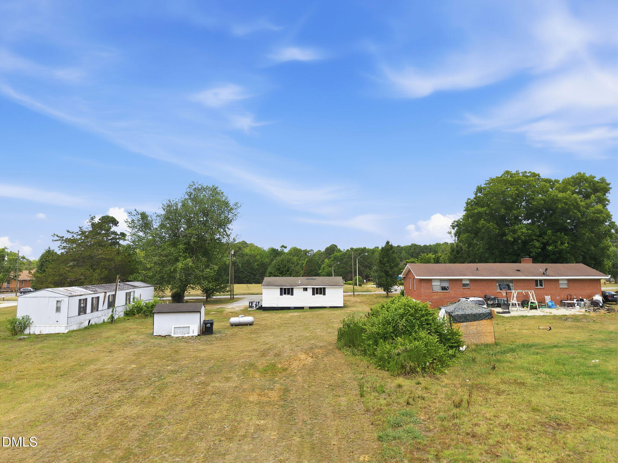 1758 Barber Mill Road Clayton, NC 27520 - Photo 23 of 41 a view of a house with a yard and sitting area
