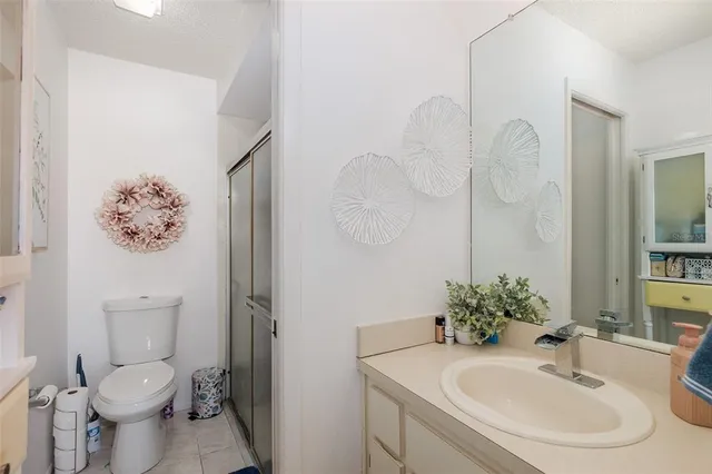 a bedroom with a bed and a chair