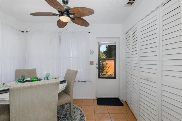 a view of a dining room with furniture wooden floor and chandelier