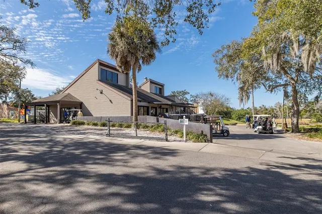 a view of a lake with houses next to a yard