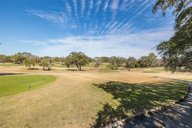 a view of an outdoor space and tennis court