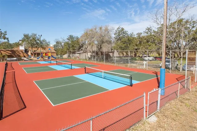 a childrens park with lots of swings and slides