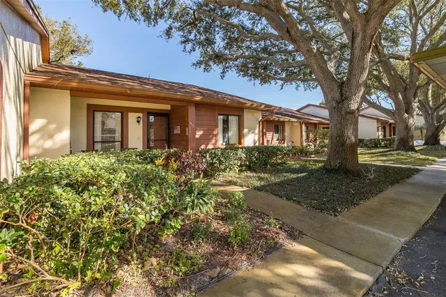 a view of a pathway with a wrought fence