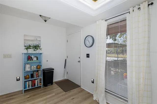 a kitchen with stainless steel appliances a refrigerator sink and white cabinets