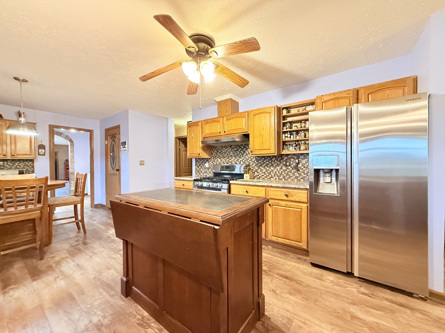 147 Hazel Road Simpson, IL 62985 - Photo 12 of 56 a kitchen with stainless steel appliances granite countertop a sink and a refrigerator