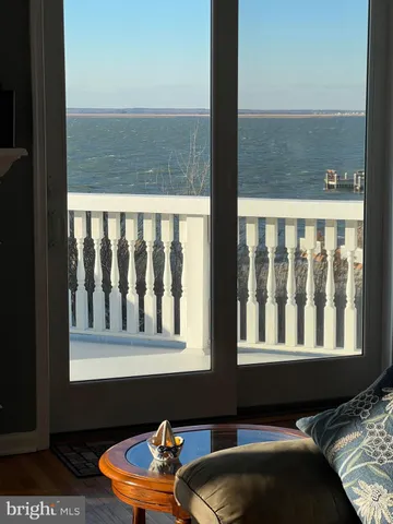 a blue chair sitting in front of a window