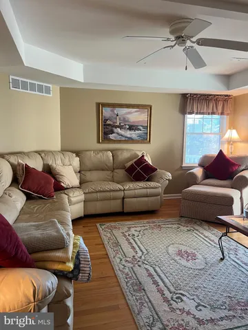 a living room with furniture and a rug