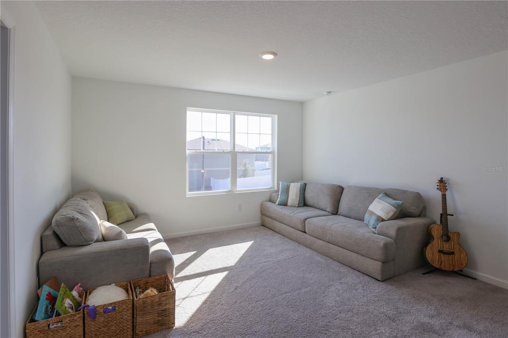2240 Hemingway Circle Groveland, FL 34736 - Photo 17 of 34 a living room with furniture and a window