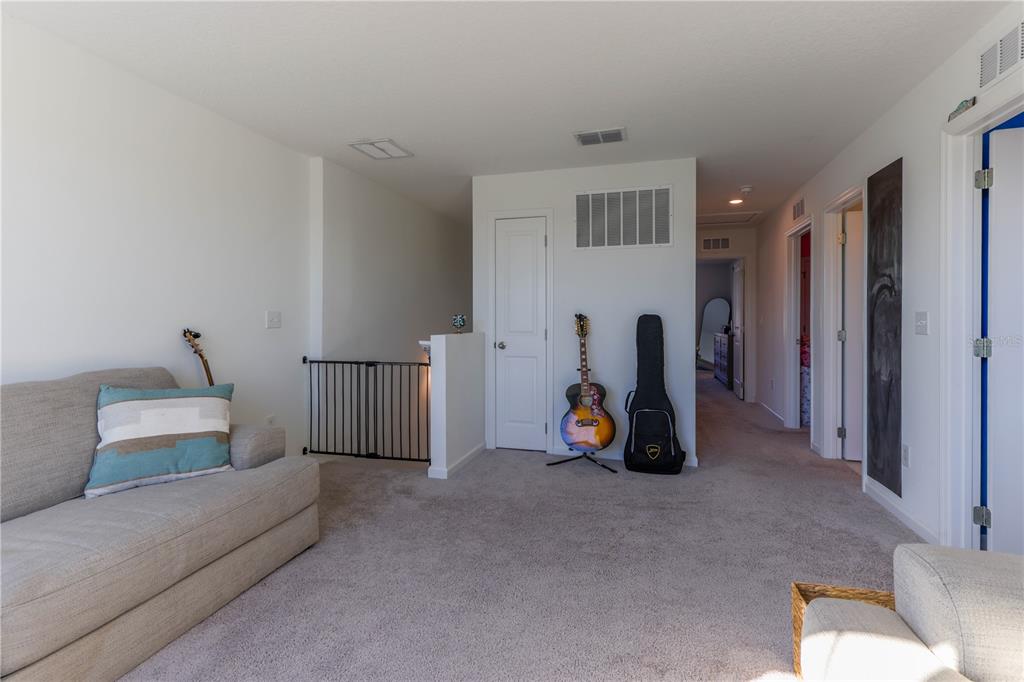 2240 Hemingway Circle Groveland, FL 34736 - Photo 20 of 34 a view of a livingroom with furniture and toys