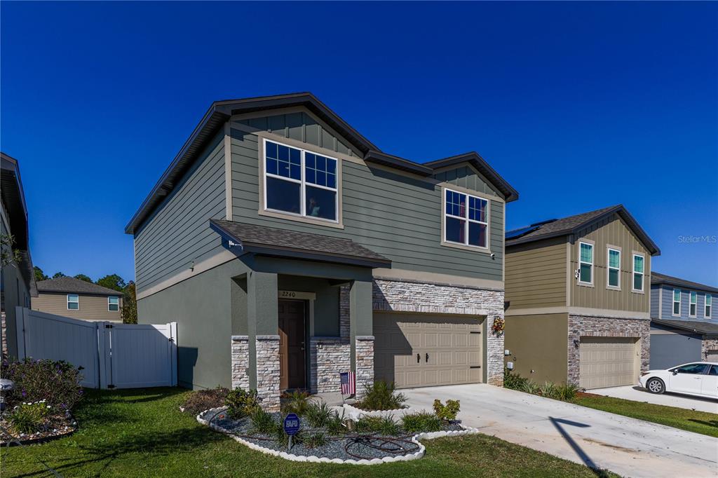 2240 Hemingway Circle Groveland, FL 34736 - Photo 2 of 34 a front view of a house with garden