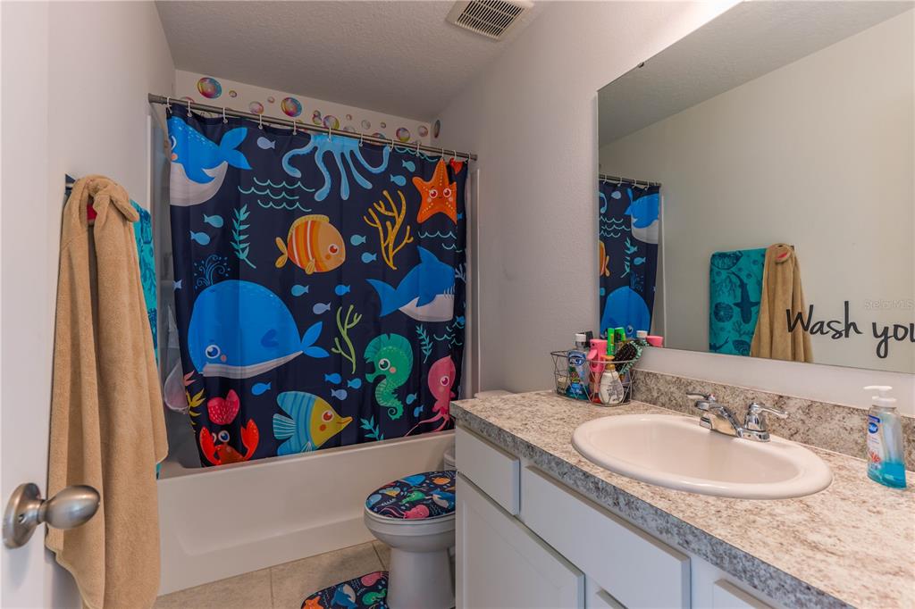 2240 Hemingway Circle Groveland, FL 34736 - Photo 26 of 34 a bathroom with a sink and a mirror