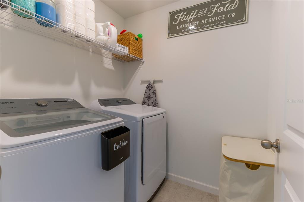 2240 Hemingway Circle Groveland, FL 34736 - Photo 27 of 34 a utility room with dryer and washer