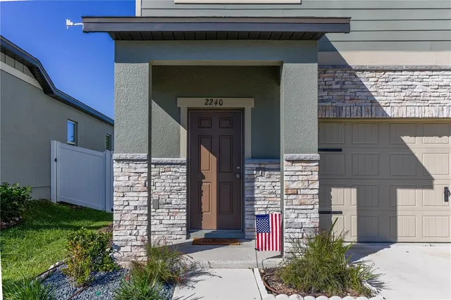 a front view of a house with an outdoor space