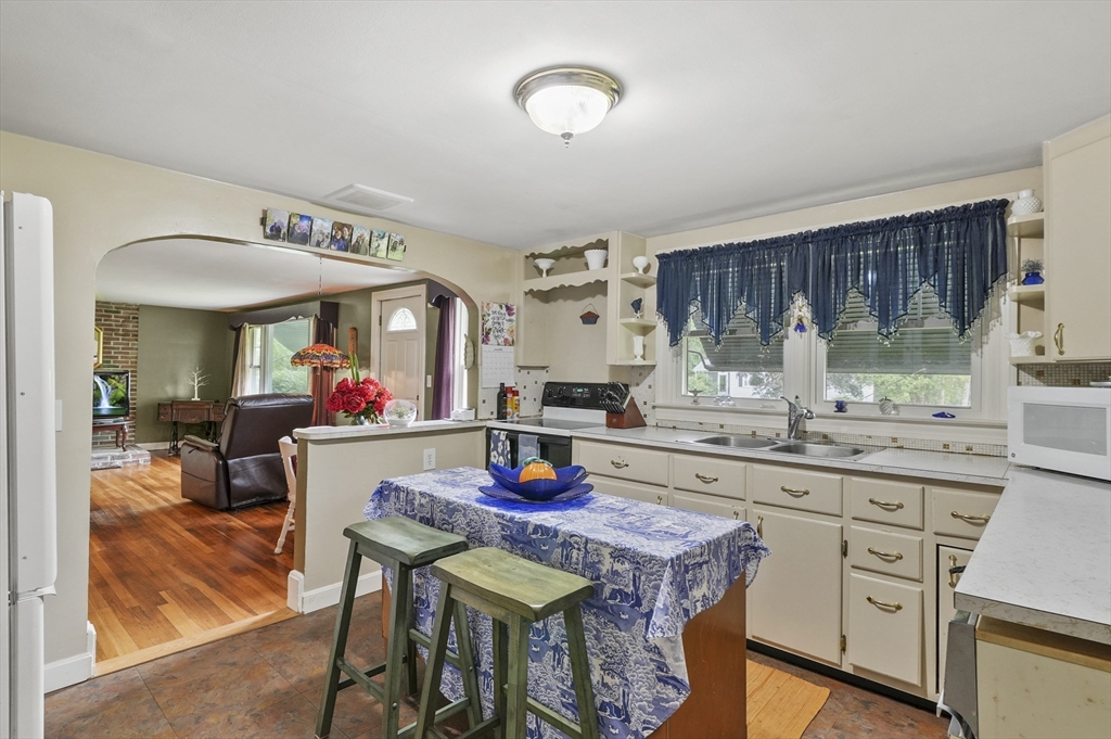 49 Winchendon Road Baldwinville, MA 01436 - Photo 12 of 33 a kitchen with stainless steel appliances granite countertop a sink and cabinets