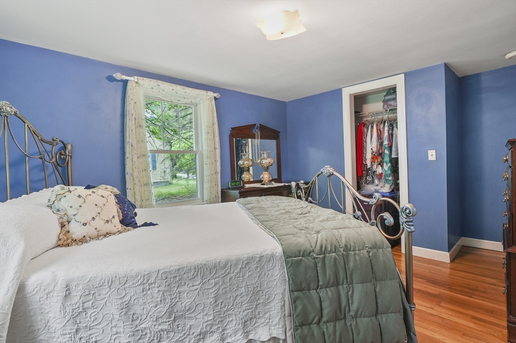 49 Winchendon Road Baldwinville, MA 01436 - Photo 17 of 33 a bedroom with a bed and a dresser next to a window