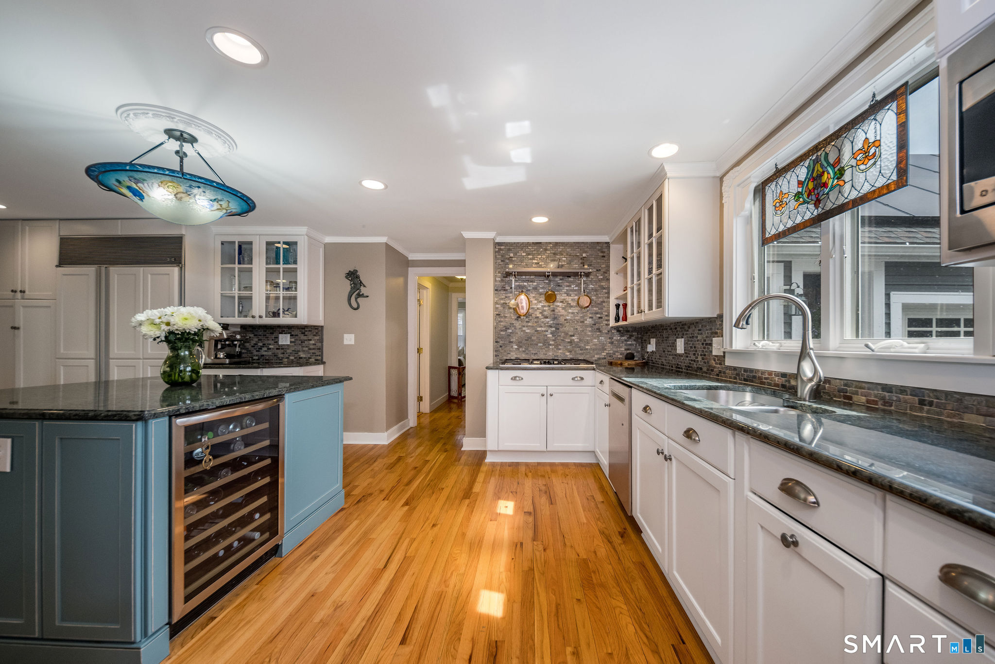 24 Cottage Place Old Saybrook, CT 06475 - Photo 11 of 38 a large kitchen with stainless steel appliances granite countertop a lot of counter space and wooden floors