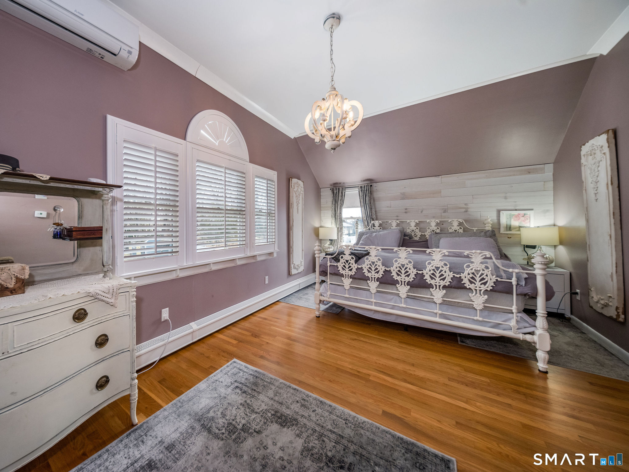 24 Cottage Place Old Saybrook, CT 06475 - Photo 16 of 38 a living room with furniture and a chandelier