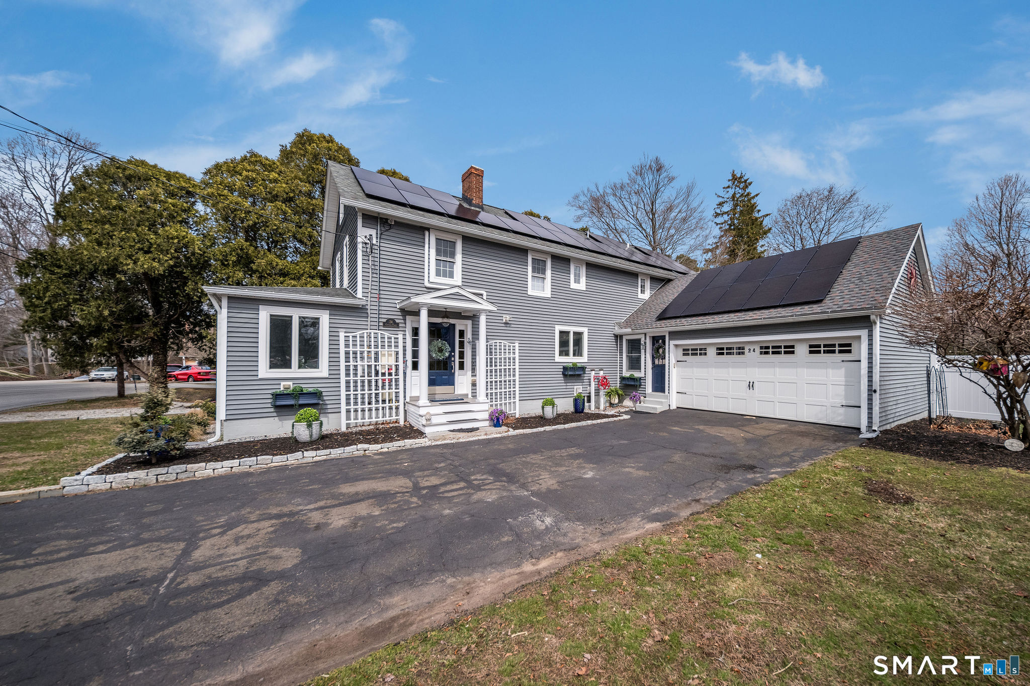 24 Cottage Place Old Saybrook, CT 06475 - Photo 2 of 38 a view of a house with a yard and potted plants