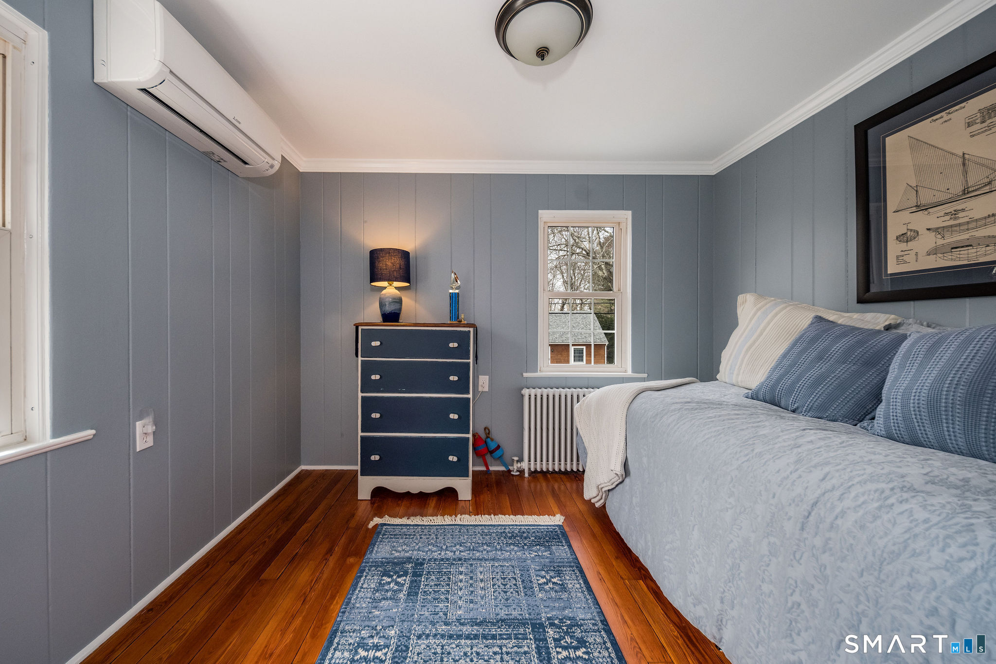24 Cottage Place Old Saybrook, CT 06475 - Photo 22 of 38 a bedroom with a bed and wooden floor